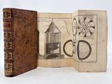 un vieux livre dans lequel figure l'image d'un phare
