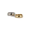 two gold and silver rings on a white background