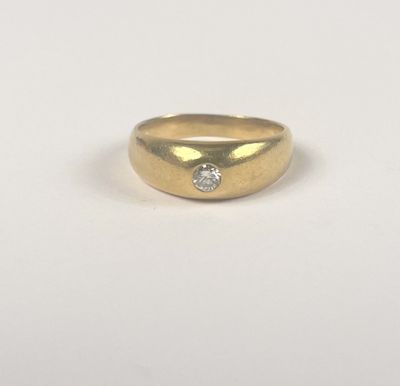 a gold ring with a diamond on top of it