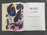 an open book with a picture of a painting on it