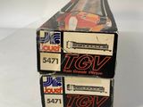 two boxes of toy cars are stacked on top of each other