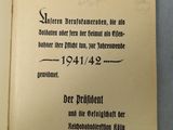 an open book with german text on it sitting on top of a table
