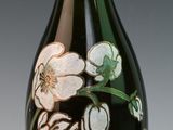 a bottle of champagne with a floral design on it
