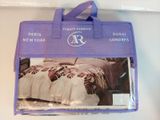 a purple bag that has a picture of a bed in it