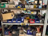 many boxes of tools on the shelves in the garage
