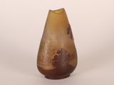 a small vase that has a brown and brown design on it