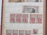 an open book with stamps on it on a table