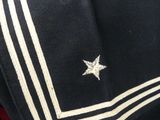 a close up of a uniform with a star on it