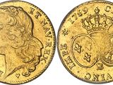a gold sovereign coin with a crown on it