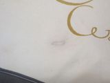 a close up of a logo on a white shirt