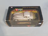 a box with a toy car in it on a table