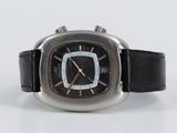 a close up of a watch on a white surface