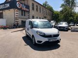 a white van parked in front of a building