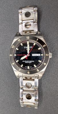 a close up of a wrist watch on a table