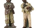 paire de figurines en bronze représentant un garçon et un garçon coiffé d'un chapeau