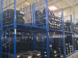 many tires on the shelves in the warehouse
