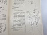 an open book with a drawing of a man on it