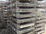 a large pile of cages stacked on top of each other