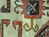 an image of a close up of a rug with a clock on it