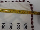 someone is measuring the size of a pillow with a tape