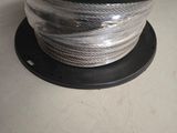 a close up of a spool of wire on a table