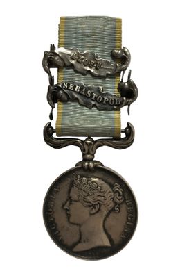 une image représentant une médaille sur laquelle figure le visage d'une femme