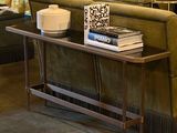 a living room with a couch and a table with a book on it