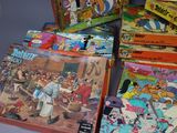 a lot of cartoon books that are on the table