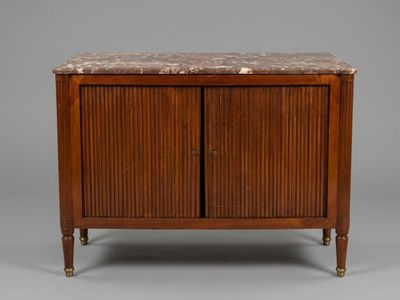 a walnut cabinet with marble top