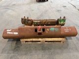 a large pipe sitting on a pallet in the middle of a parking lot