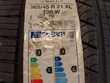 the tire tread of a car with a sticker on it ' s side