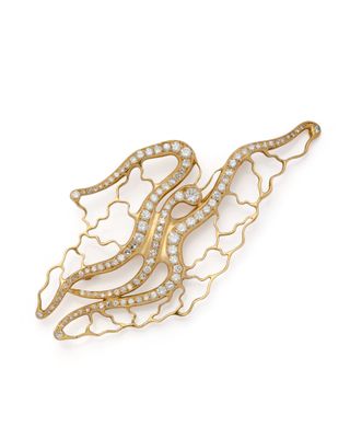 une broche en forme de serpent en or et diamants