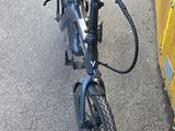 a bicycle that is parked on the side of the road