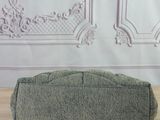 grey wool pencil case sitting on a wooden table