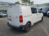 a white van that is parked in a parking lot