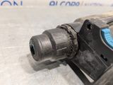 an image of a close up of a drill on a table