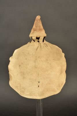 a close up of a piece of cloth with a hat on it