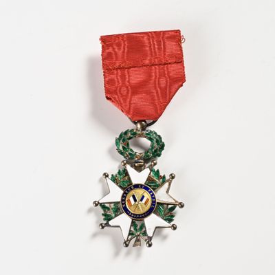 a medal with a star on it on a white surface