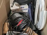 a cardboard box with a bunch of wires and a bowl in it