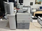 a printer that is sitting on the floor in a room
