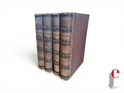 three books are stacked on top of each other on a white surface