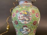 an image of a colorful vase with a lamp on top of it