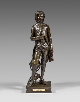 a bronze statue of a man with a dog