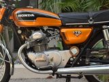 a motorcycle that is parked on the side of the street