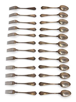 a lot of spoons and forks on a white surface