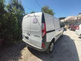 a white van that is parked on the side of the road