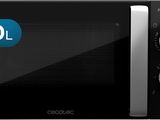 a close up of a microwave oven with the door open