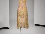 an image of a dress on a mannequin stand in a room