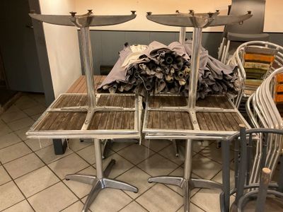 a table that has a bunch of chairs on top of it