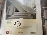 a box of bedding on a table with a price tag on it
